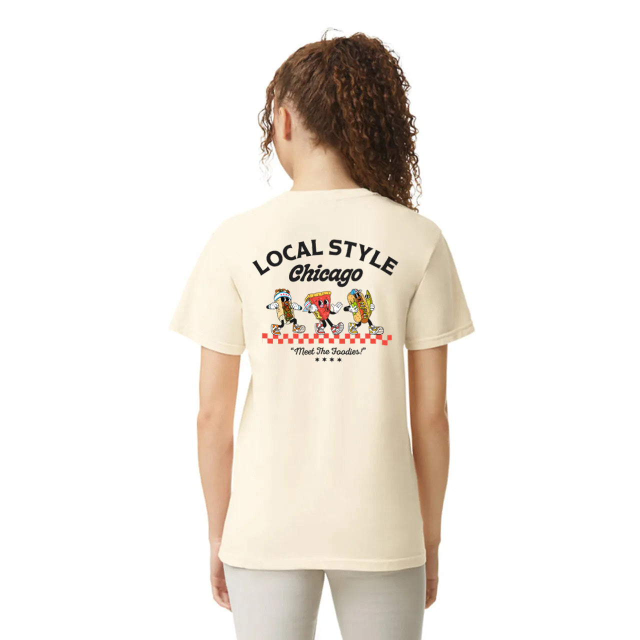 Person wearing a cream-colored t-shirt with 'Local Style Chicago' text and cartoon characters on the back.
